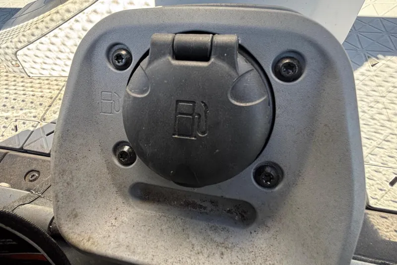 Slide: The Image of Fuel cap of 2023 Sea-Doo Switch Cruise 21, close-up view. - 92