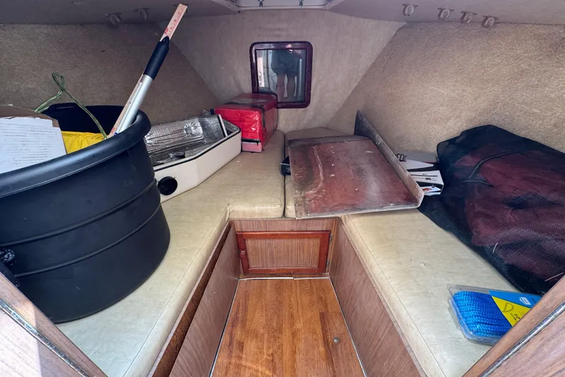 Slide: The Image of Interior cabin of a 1963 Bertram 31 Sportfisher with various stored items. - 10