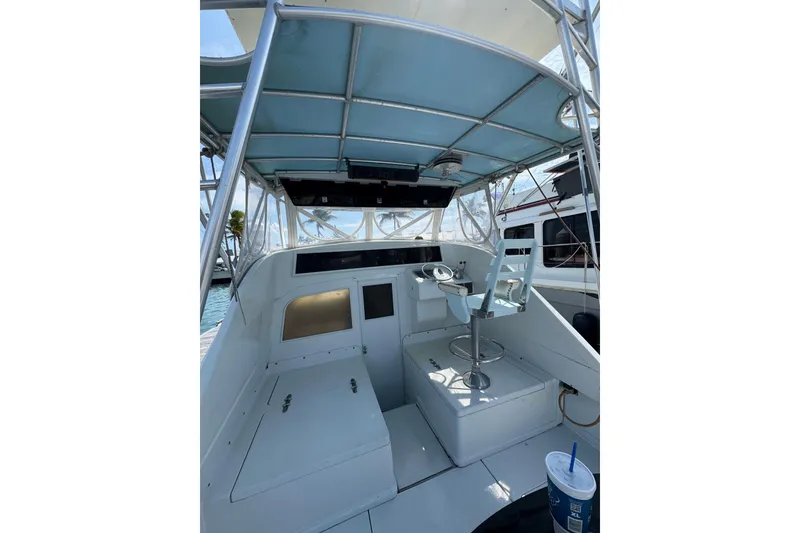 Slide: The Image of 1963 Bertram 31 Sportfisher boat interior with helm and seating area. - 13
