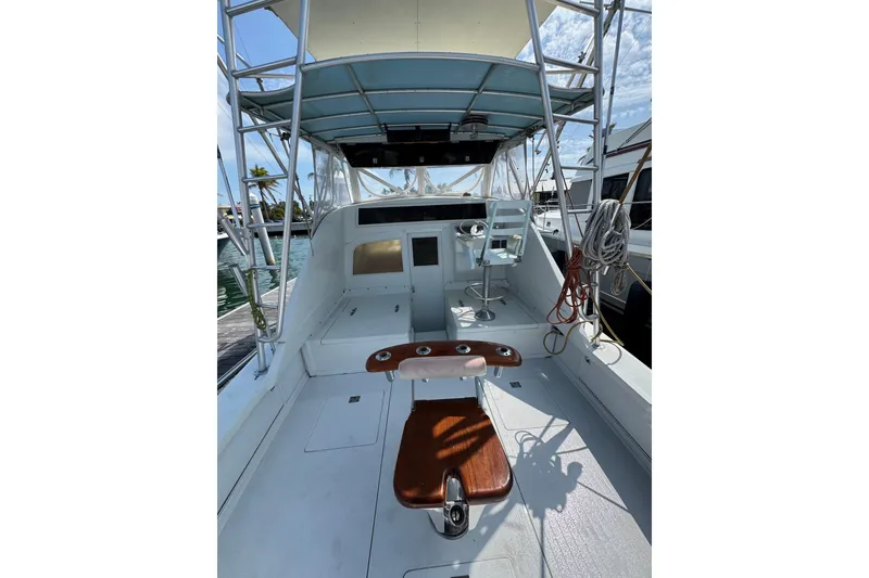Slide: The Image of 1963 Bertram 31 Sportfisher boat interior with fishing chair and helm station. - 17