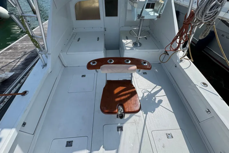 Slide: The Image of 1963 Bertram 31 Sportfisher boat interior with fishing chair and equipment. - 18