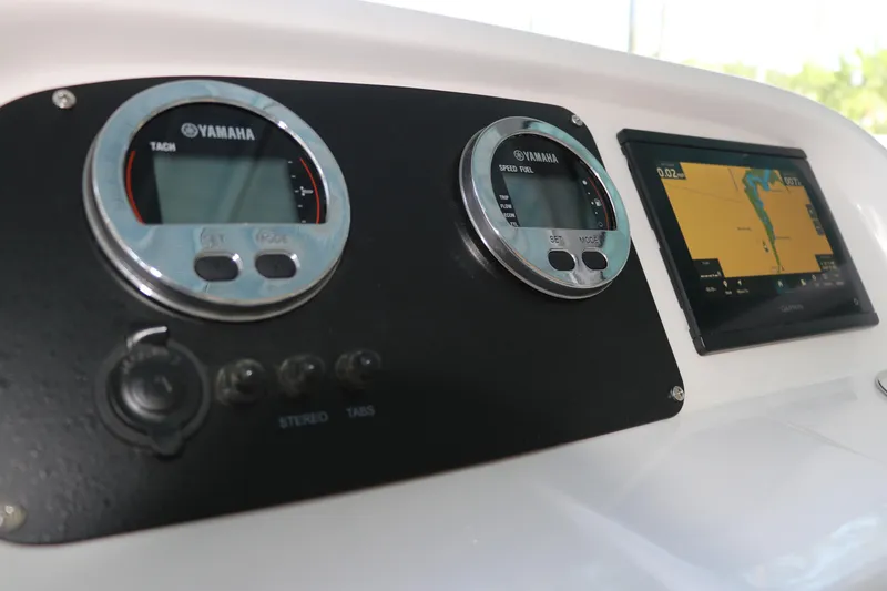 Slide: The Image of Dashboard of 2026 Robalo R207 Dual Console with Yamaha gauges and Garmin display. - 18