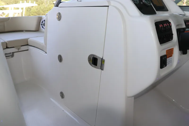 Slide: The Image of 2026 Robalo R207 Dual Console interior with control panel and seating area. - 21