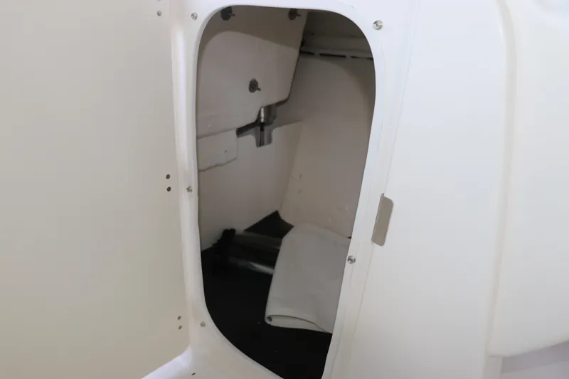 Slide: The Image of Interior storage compartment of 2026 Robalo R207 Dual Console boat. - 22