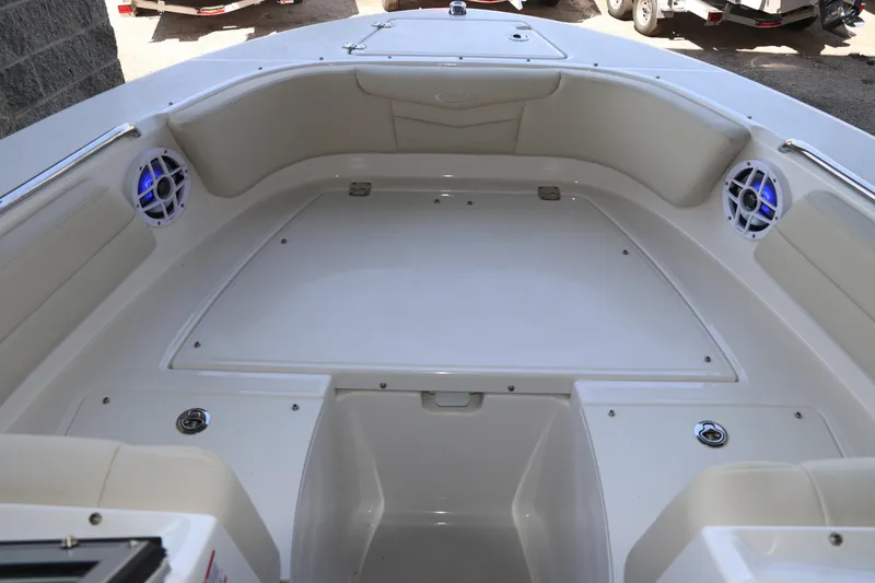Slide: The Image of 2026 Robalo R207 Dual Console boat interior with seating and speakers. - 25