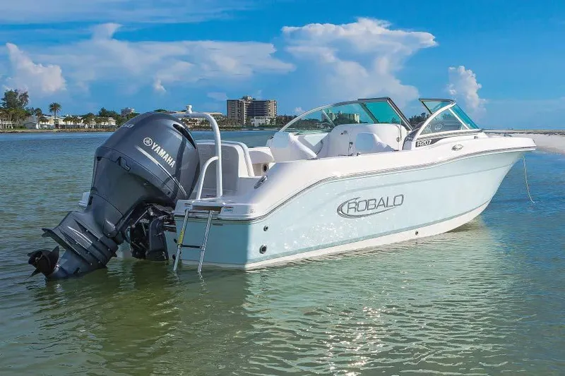 Slide: The Image of Manufacturer Provided Image: 2025 Robalo R207 Dual Console boat with Yamaha engine on calm water. - 33