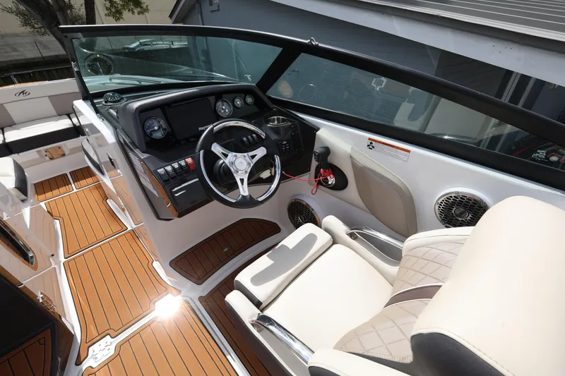 Slide: The Image of 2021 Monterey M-65 boat interior with modern dashboard and luxurious seating. - 15