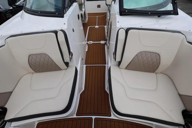 Slide: The Image of Luxurious seating on 2021 Monterey M-65 boat with elegant design and teak flooring. - 19