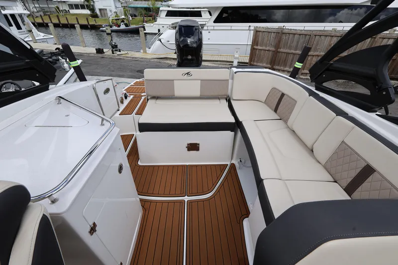 Slide: The Image of Luxurious interior of 2021 Monterey M-65 boat with elegant seating and teak flooring. - 21