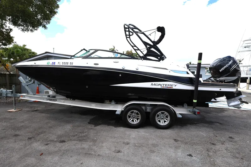 Slide: The Image of 2021 Monterey M-65 boat on trailer with Mercury outboard motor. - 4
