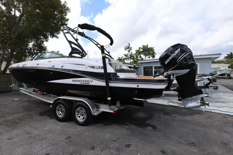 Slide: The Image of 2021 Monterey M-65 boat on trailer with Mercury outboard motor. - 5