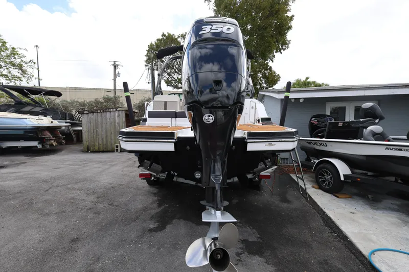 Slide: The Image of 2021 Monterey M-65 boat with powerful 350 engine, parked outdoors. - 7