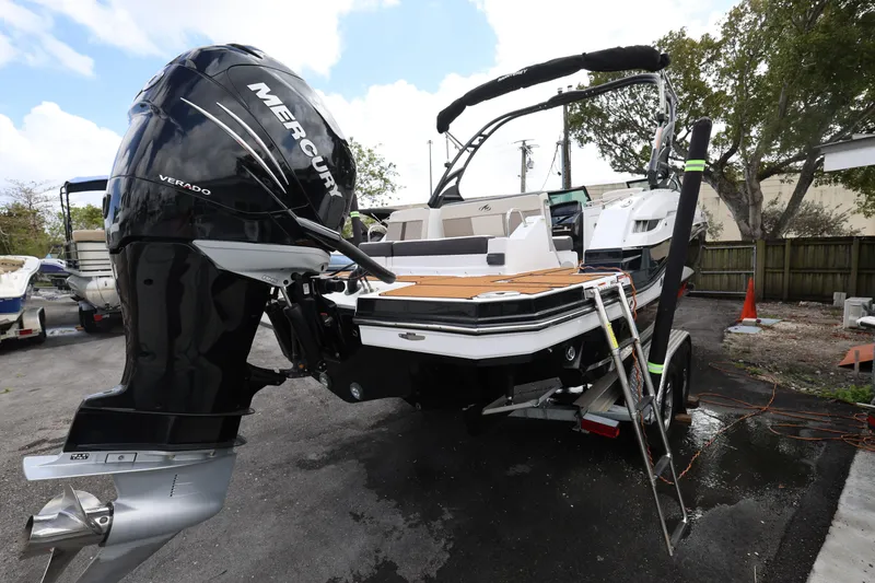 Slide: The Image of 2021 Monterey M-65 boat with Mercury Verado engine on trailer. - 8