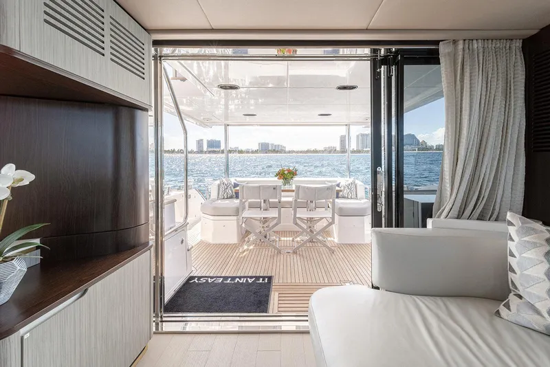 Slide: The Image of Luxurious interior of 2020 Azimut 60 yacht with ocean view and elegant seating area. - 20