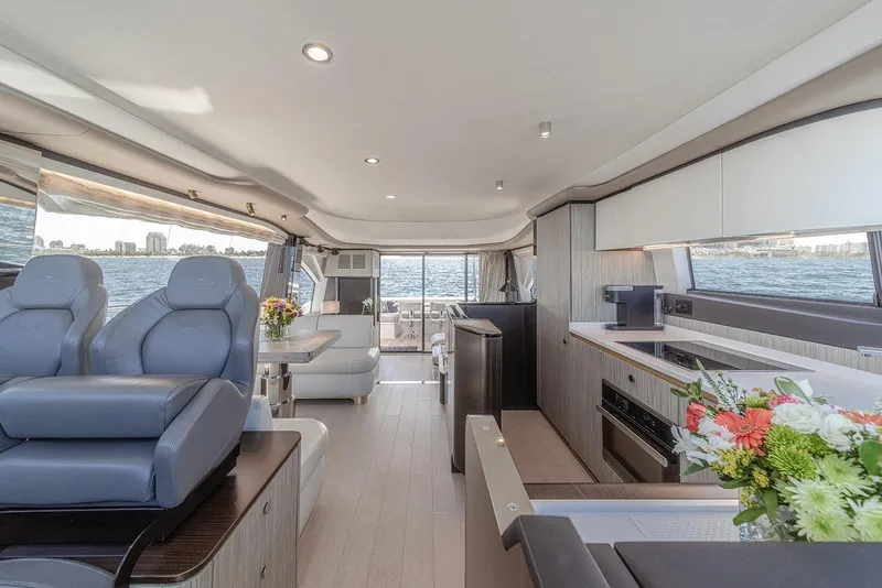 Slide: The Image of Luxurious interior of 2020 Azimut 60 yacht with modern seating and kitchen area. - 21