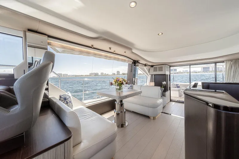 Slide: The Image of Luxurious interior of 2020 Azimut 60 yacht with elegant seating and panoramic water views. - 26