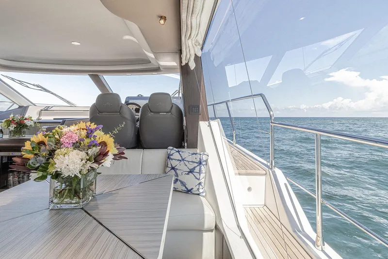 Slide: The Image of Luxurious interior of 2020 Azimut 60 yacht with ocean view and floral decor. - 27