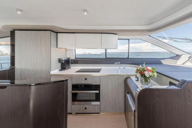 Slide: The Image of Luxurious interior of 2020 Azimut 60 yacht with modern kitchen and ocean view. - 29