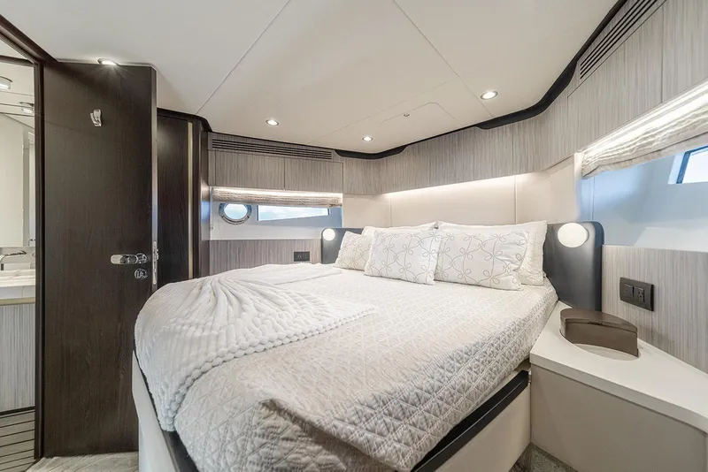 Slide: The Image of Luxurious bedroom interior of 2020 Azimut 60 yacht with modern design and cozy bedding. - 34