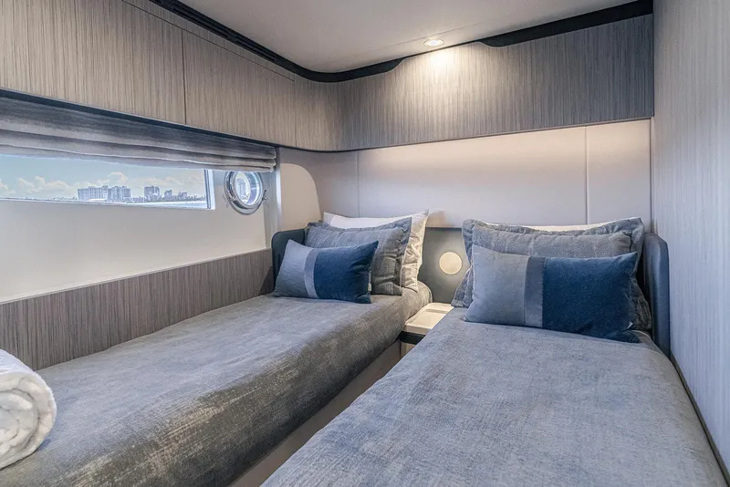 Slide: The Image of Luxurious cabin interior of 2020 Azimut 60 yacht with twin beds and elegant decor. - 36