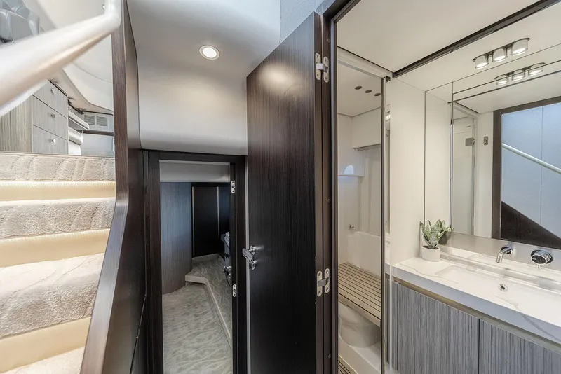 Slide: The Image of Interior of 2020 Azimut 60 yacht featuring stairs, bathroom, and modern design elements. - 37