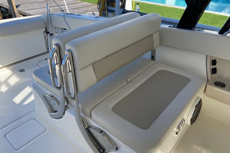 Slide: The Image of 2024 Boston Whaler 320 Vantage interior seating with sleek design and modern features. - 18
