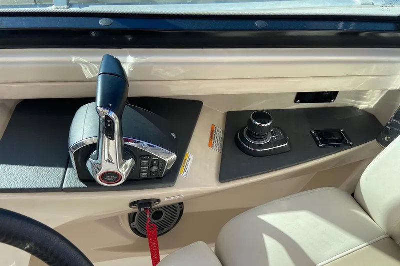 Slide: The Image of 2024 Boston Whaler 320 Vantage helm controls with joystick and throttle. - 25