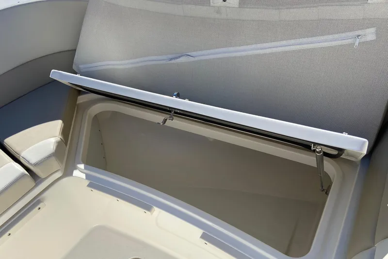 Slide: The Image of 2024 Boston Whaler 320 Vantage boat storage compartment with open lid. - 31