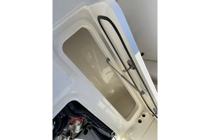 Slide: The Image of Open storage compartment on 2024 Boston Whaler 320 Vantage boat. - 44