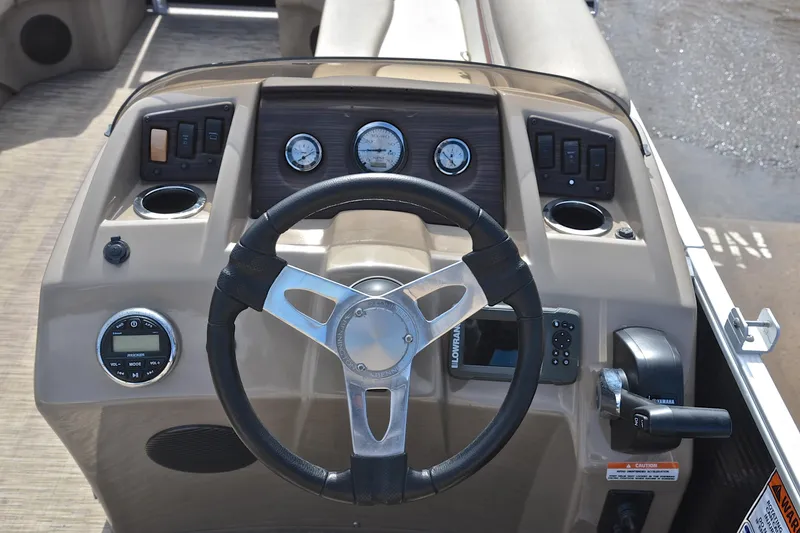 Slide: The Image of Steering console of 2019 Bennington 21 SSX pontoon boat with gauges and controls. - 25