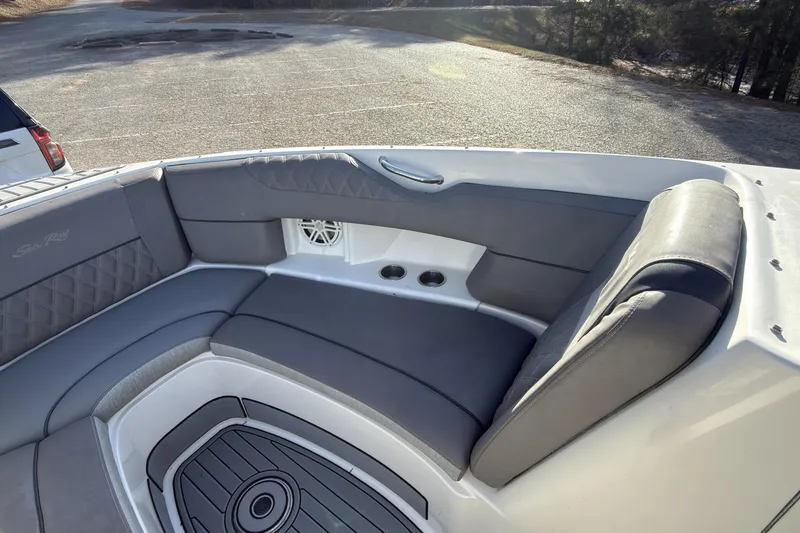 Slide: The Image of 2008 Sea Ray 270 SLX boat interior with gray seating and cup holders. - 12