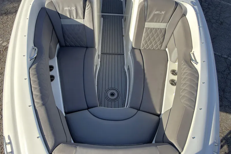Slide: The Image of 2008 Sea Ray 270 SLX boat interior with gray cushioned seating and sleek design. - 13
