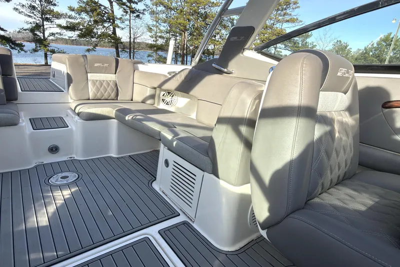 Slide: The Image of 2008 Sea Ray 270 SLX boat interior with gray seating and lake view. - 16