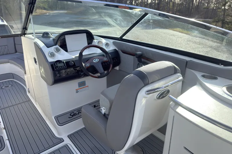 Slide: The Image of 2008 Sea Ray 270 SLX boat interior with steering wheel and dashboard. - 8