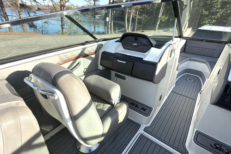 Slide: The Image of 2008 Sea Ray 270 SLX boat interior with luxurious seating and sleek dashboard design. - 9