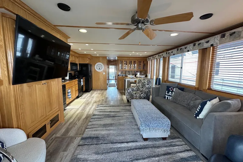Slide: The Image of Spacious 2004 Lakeview 16x68 houseboat interior with modern kitchen and cozy living area. - 2