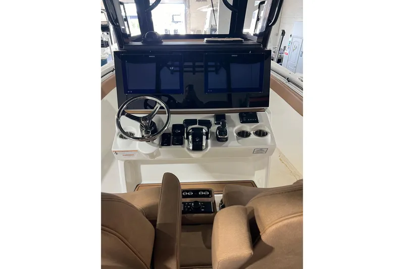 Slide: The Image of 2025 Sea Pro 322 Offshore helm with dual screens and modern controls. - 3