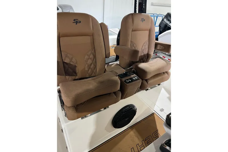 Slide: The Image of 2025 Sea Pro 322 Offshore boat with luxurious brown captain seats and armrests. - 4