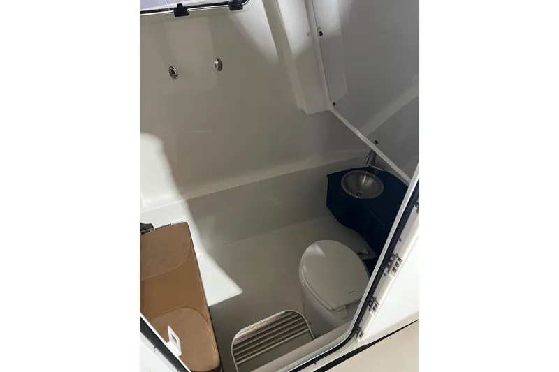 Slide: The Image of 2025 Sea Pro 322 Offshore boat interior with toilet and sink. - 6
