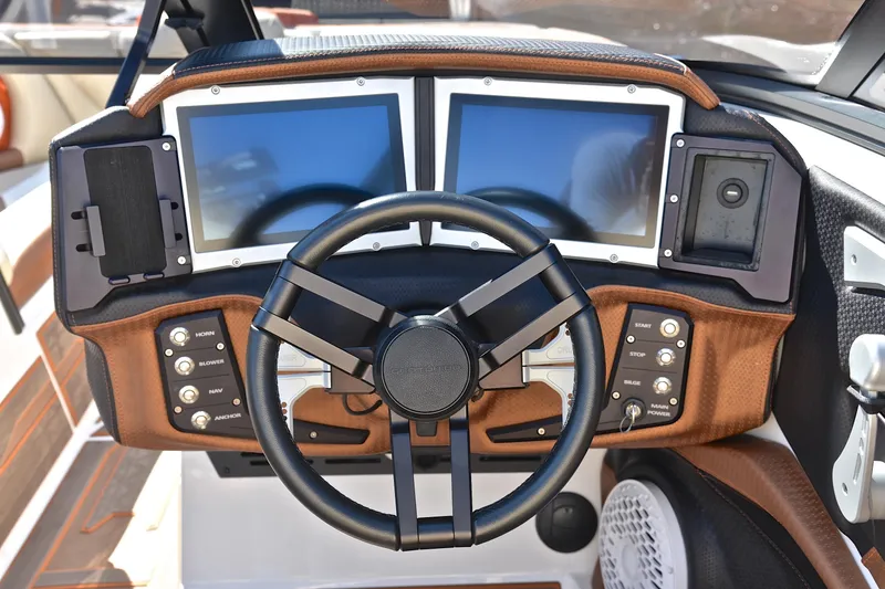 Slide: The Image of 2023 Centurion Ri230 dashboard with dual screens and modern controls. - 28