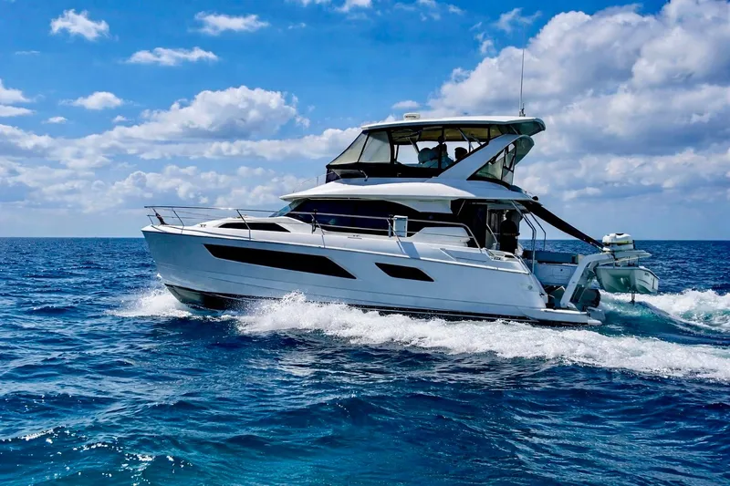 The Image of Aquila 44 Yacht 2016 cruising on open sea under a bright blue sky. - 0