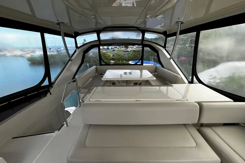 Slide: The Image of Interior view of 2016 Aquila 44 yacht with spacious seating and panoramic windows. - 10