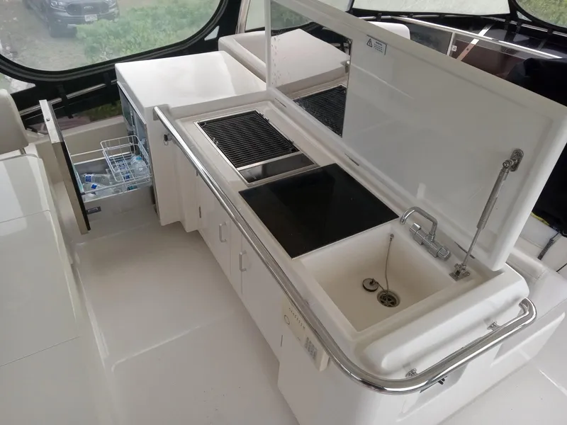 Slide: The Image of Modern kitchen area on 2016 Aquila 44 yacht with sink and grill. - 16