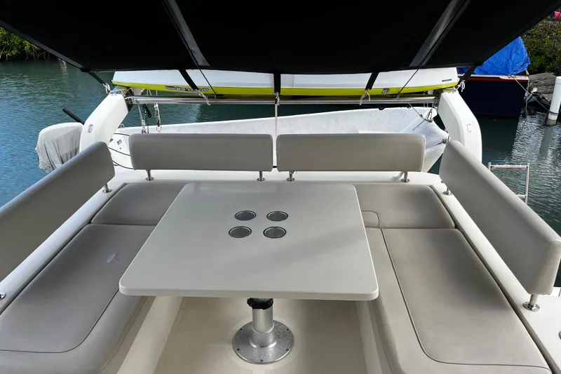 Slide: The Image of Aquila 44 yacht's outdoor seating area with table, 2016 model. - 20