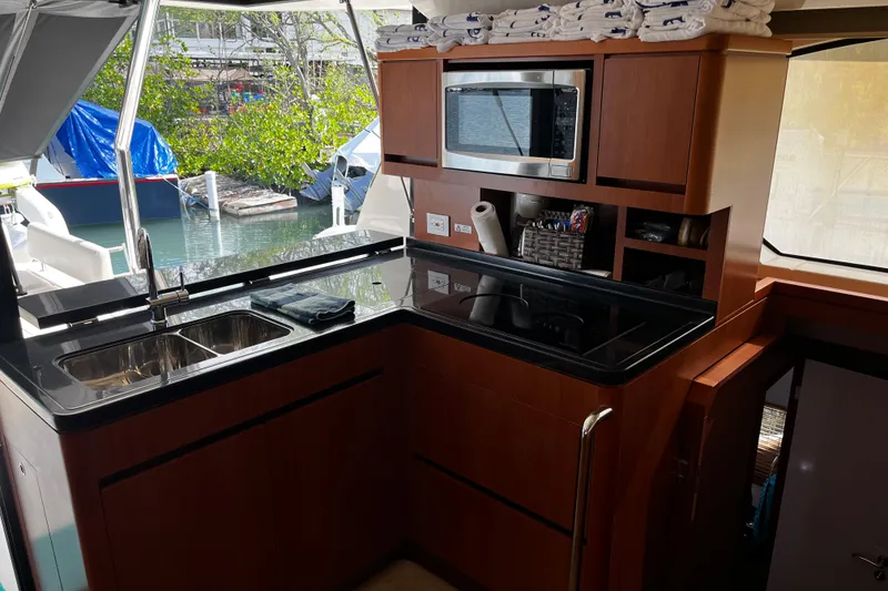 Slide: The Image of Luxurious kitchen area on a 2016 Aquila 44 yacht with modern amenities. - 22