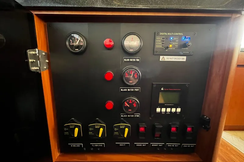 Slide: The Image of Control panel of a 2016 Aquila 44 yacht with gauges and switches. - 33