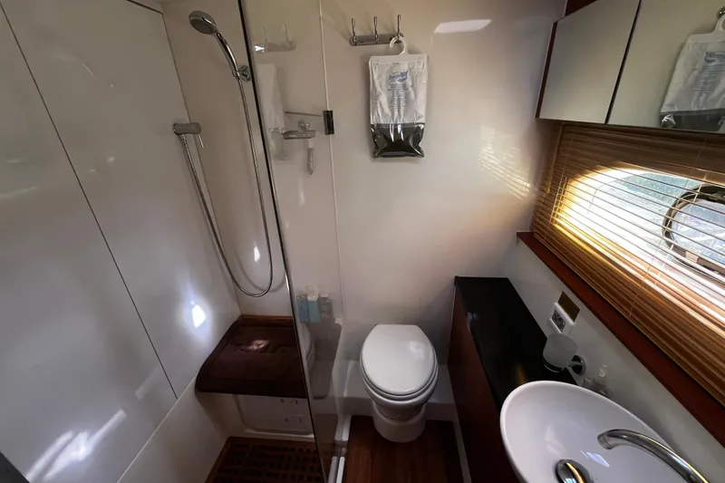 Slide: The Image of Bathroom interior of 2016 Aquila 44 yacht with shower, toilet, and sink. - 35