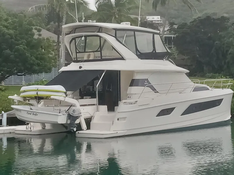 Slide: The Image of Aquila 44 yacht, 2016 model, docked in a serene marina setting. - 4