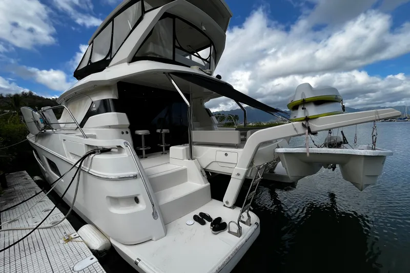 Slide: The Image of Aquila 44 yacht, 2016 model, docked with clear skies and calm waters. - 5