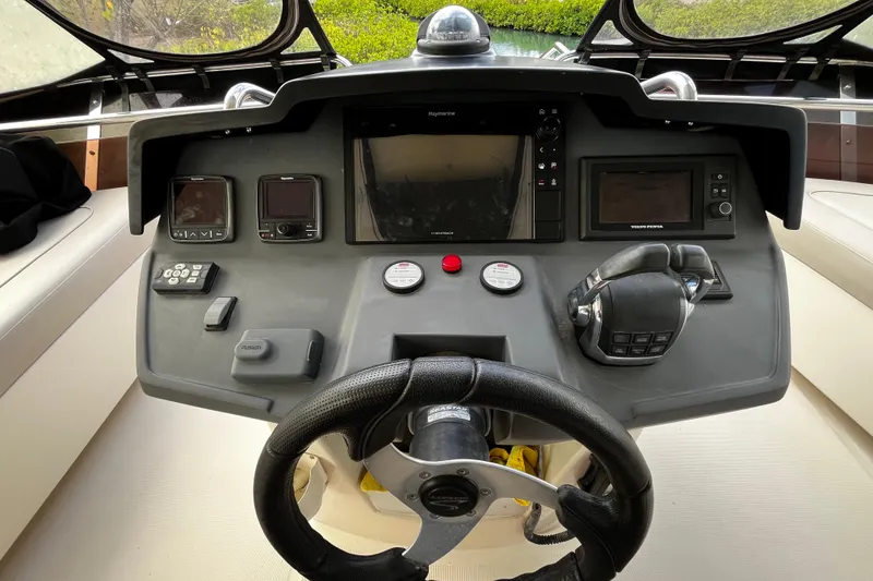 Slide: The Image of Aquila 44 yacht helm with navigation controls and steering wheel, 2016 model. - 7